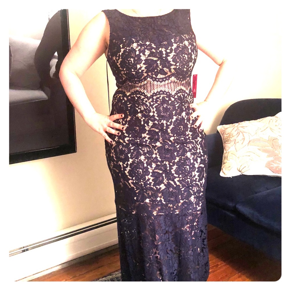 Navy lace bodes with tan underlay sleeveless gown.